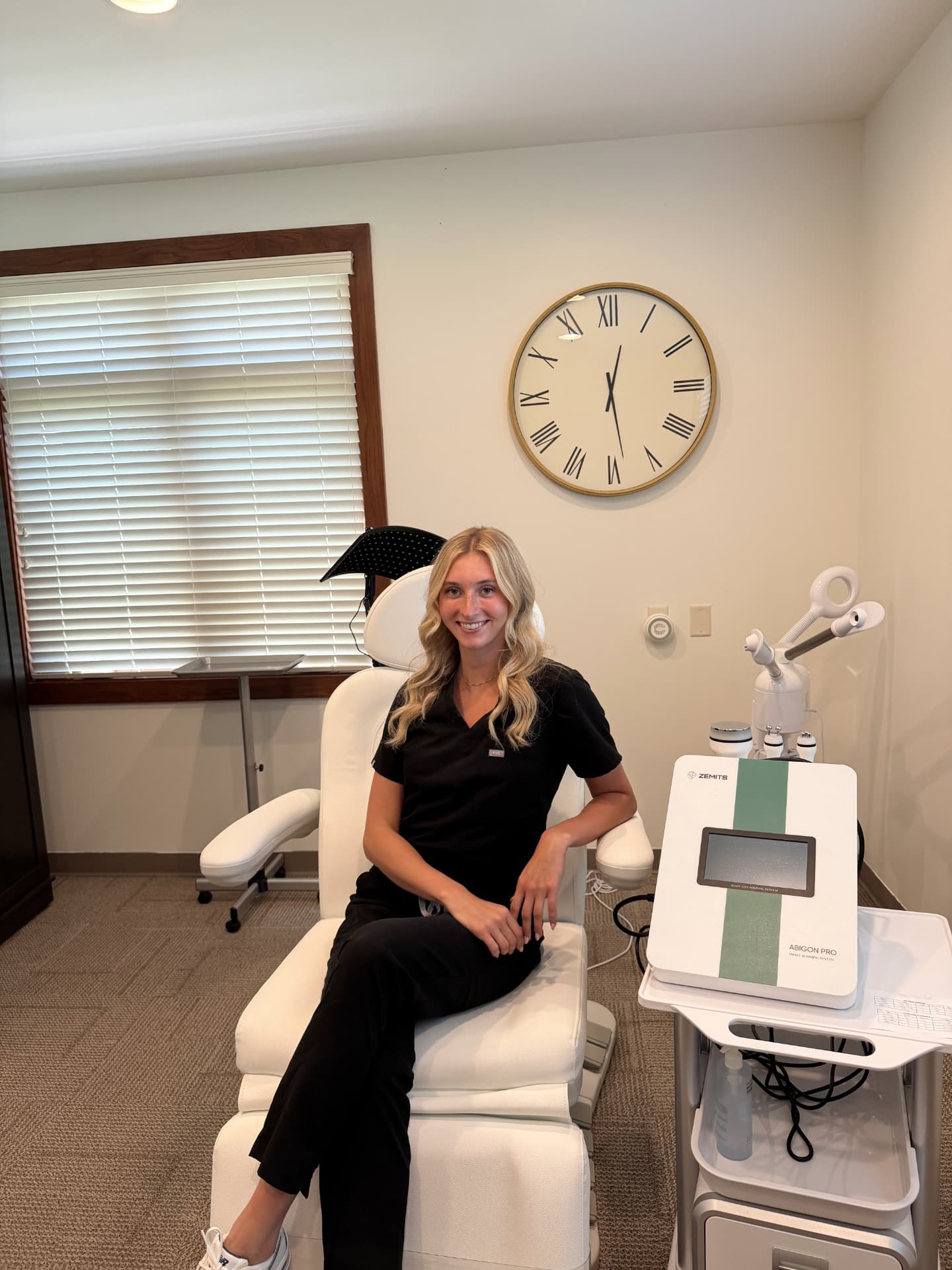 Courtney Kern seated in her treatment room at VIVID CENTRE